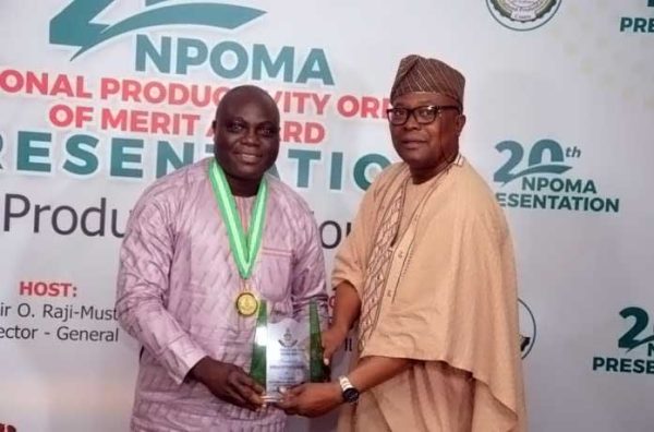 The ED receiving the award from Dr. Nasir Olaitan Raji-Mustapha, the Director General of the National Productivity Centre, Abuja