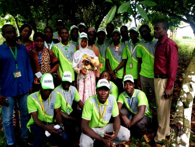 Group photograph with the students at the plot